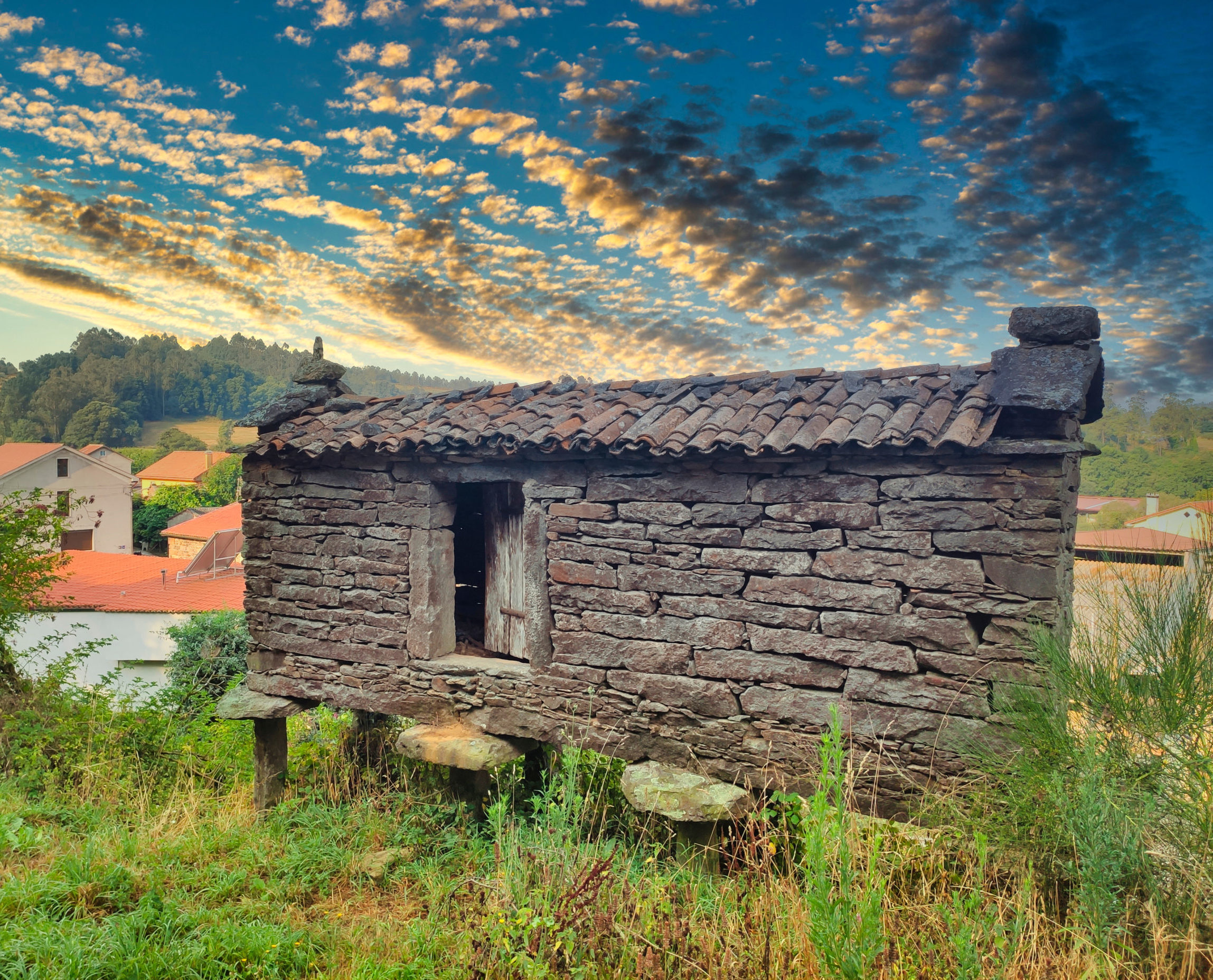 Dry-stone granary called horreo in Lago village, Mazaricos municipality, Way to Saint James, Galicia, Spain Dry-stone granary called horreo in Lago village, Mazaricos municipality, Way to Saint James, Galicia, Spain